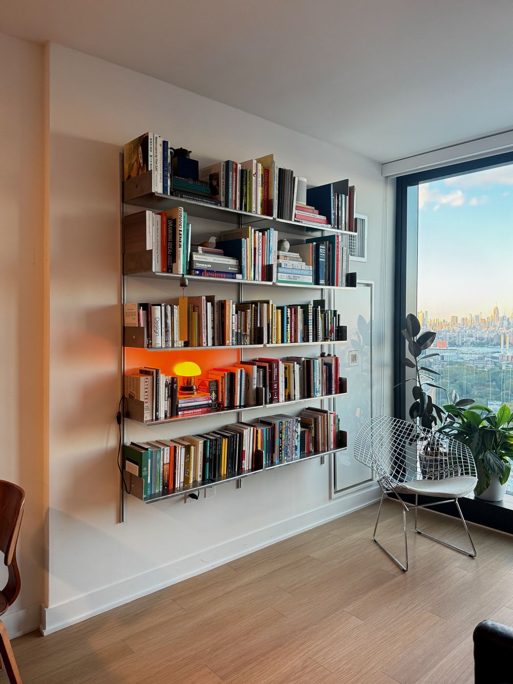 4014 shelving full of books in a corner beside a window